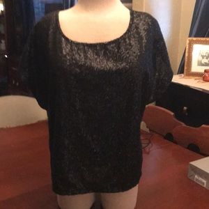 Sequined top with T-shirt material back.